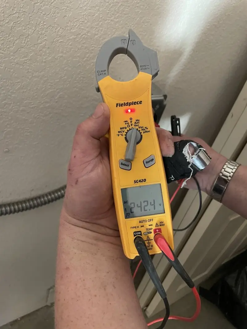 Voltage testing with clamp meter during Circuit Breaker Repair in St. Clair Shores